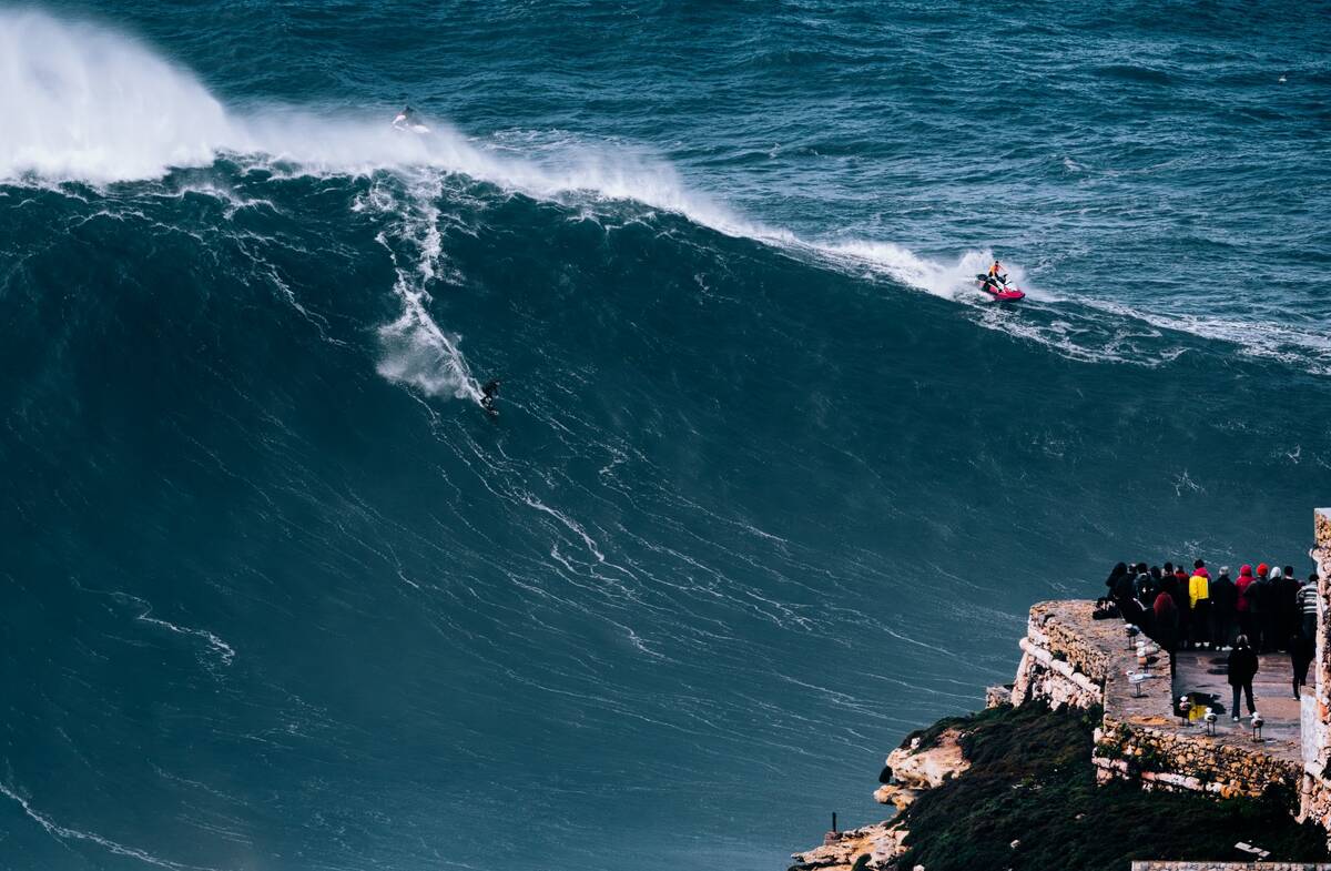 Big wave surfing and tow-in at Nazaré